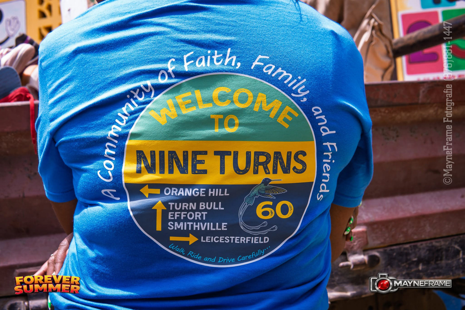The back of a Forever Summer shirt reading Welcome to Nine Turns — a community of faith, family and friends