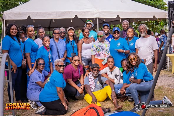 New Hope staff and volunteers posing together under the event tent